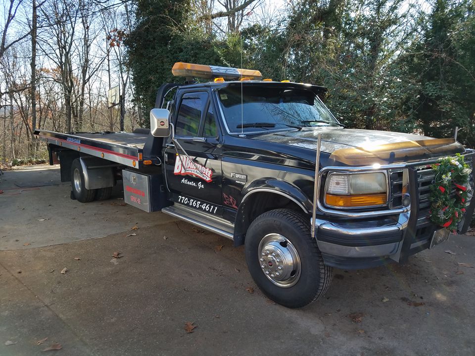 BL Burnett tow truck with wreath on it.